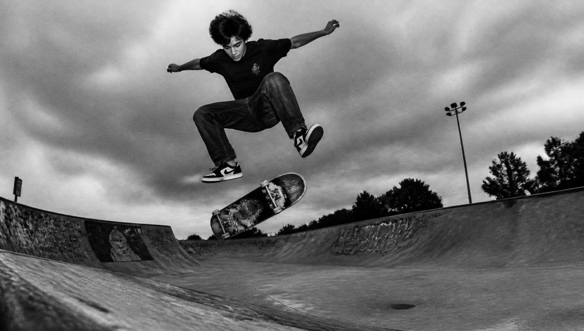 Skater launching out of a concrete bowl